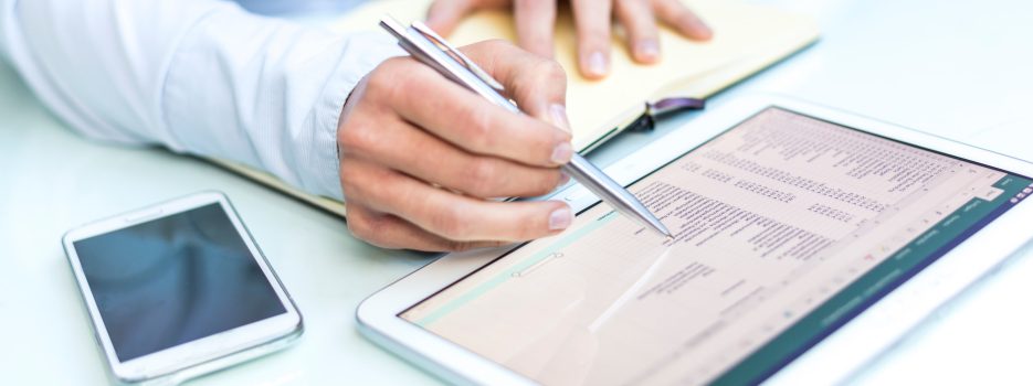 midsection businessman using digital tablet table office