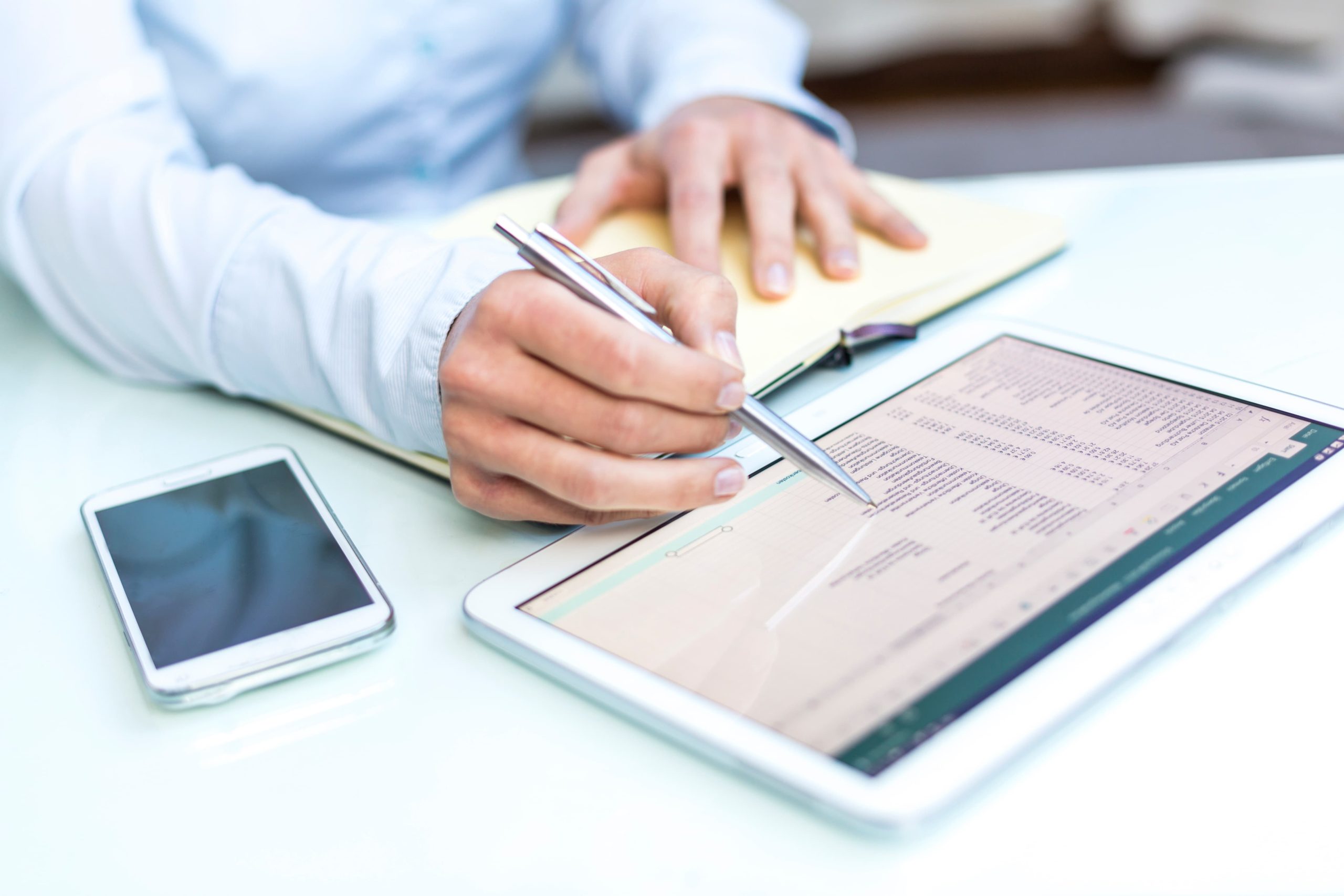 midsection businessman using digital tablet table office