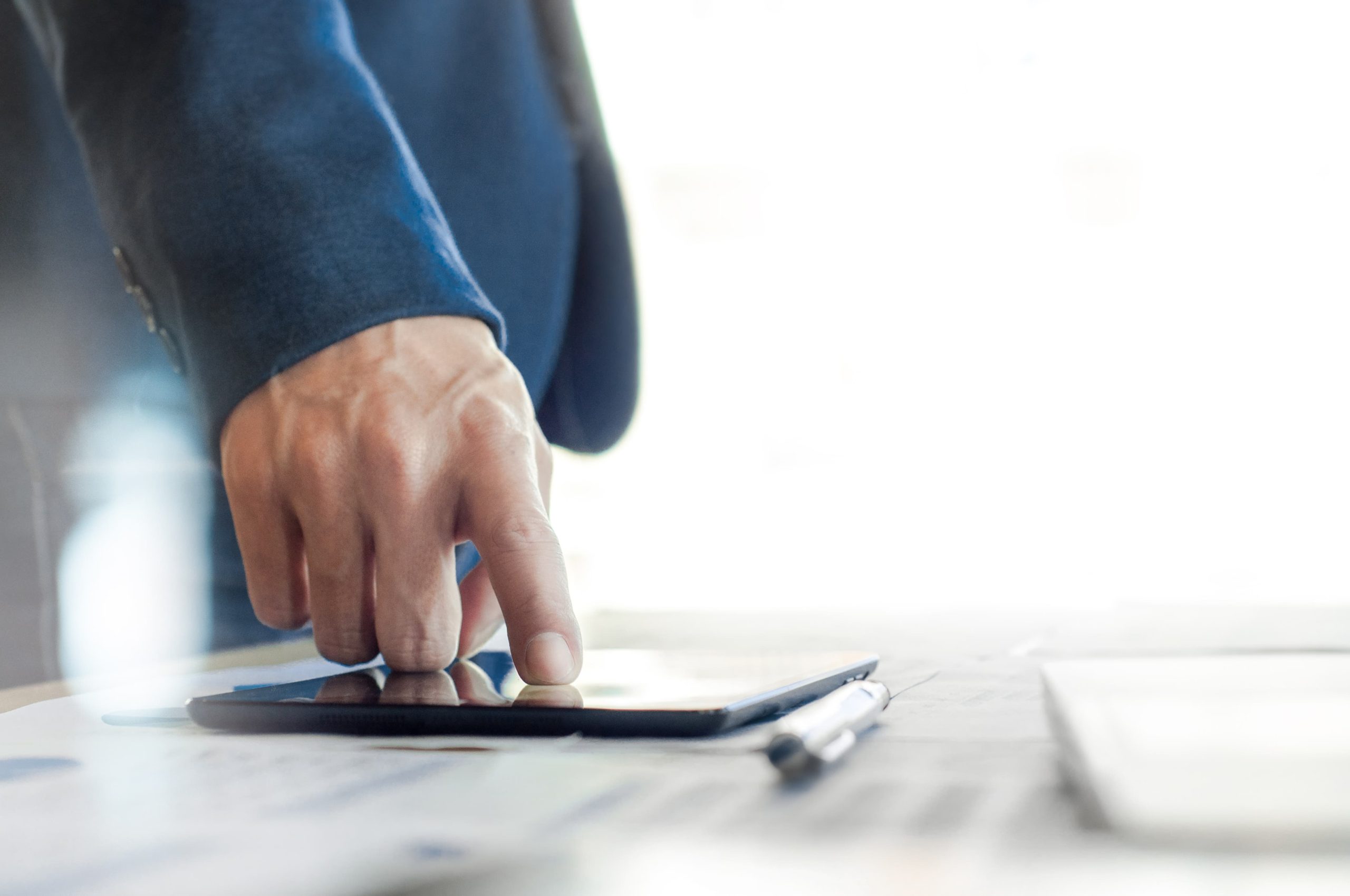 midsection businessman touching digital tablet