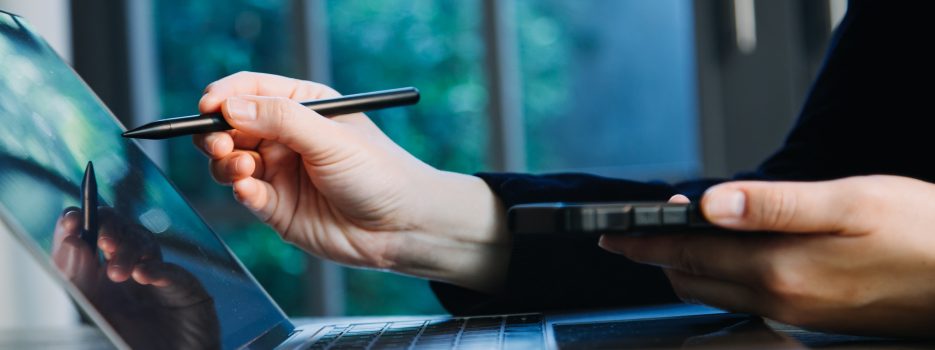 close up hands multitasking man using tablet laptop cellphone connecting wifi