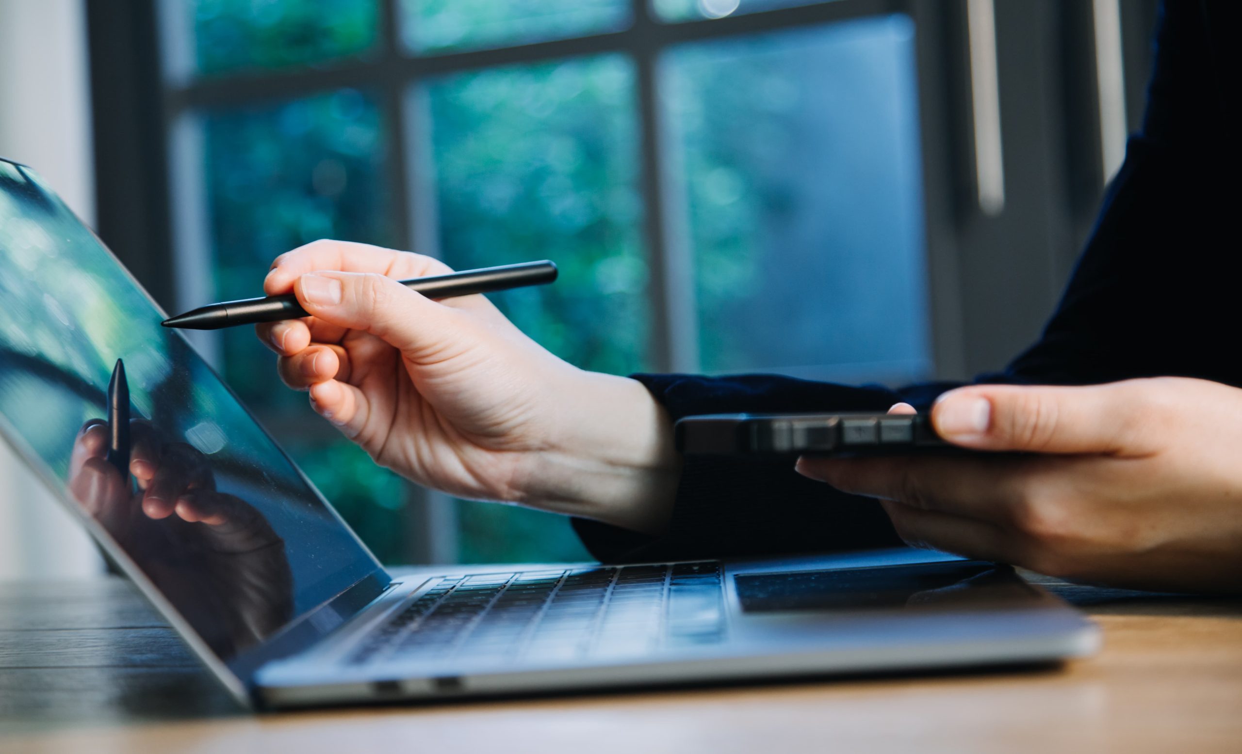 close up hands multitasking man using tablet laptop cellphone connecting wifi scaled